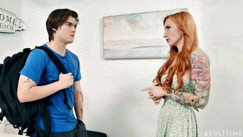 Redhead tattooed stepmom in dress talks to young backpack guy