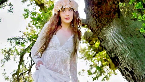Young skinny brunette teen in sheer lace dress outdoors teasing small tits with flower crown