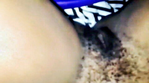 Close-up of black hairy pussy being penetrated with blue panties aside