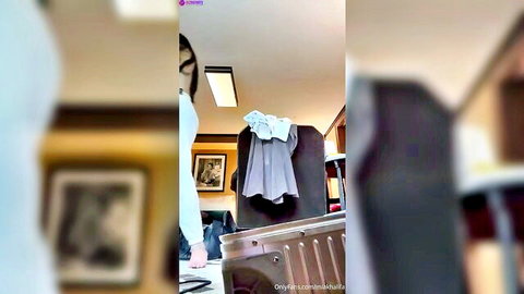 Curvy olive brunette with big tits and huge ass poses naked solo from behind in hotel room