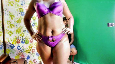Curvy Sri Lankan babe in purple bra and panties poses seductively with hands on hips flaunting tits and ass