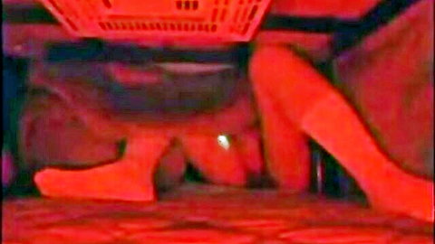 Cute teacher in red stockings hiding, teasing legs from below