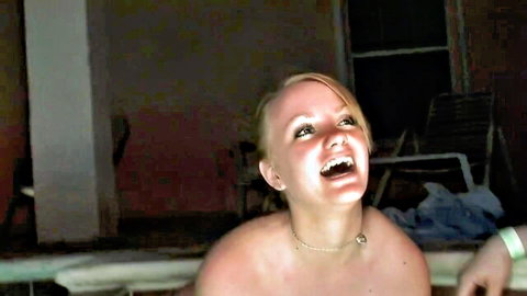 Blonde beauty topless and smiling by the pool in solo heat