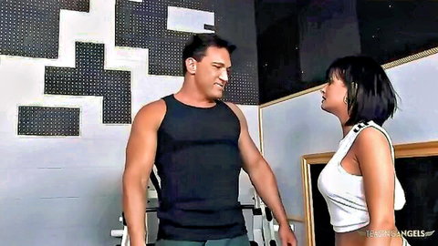 Cute Asian beauty in white crop top chats with muscular Latino hunk in gym workout gear