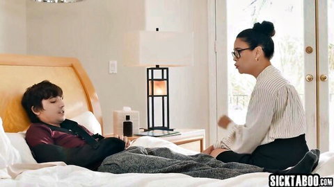 Asian teacher seduces injured student on bed in intimate encounter