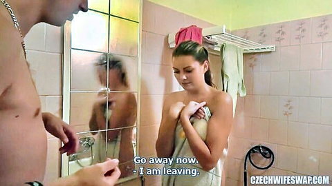 Czech wife in towel emotionally confronts shirtless man in bathroom scene