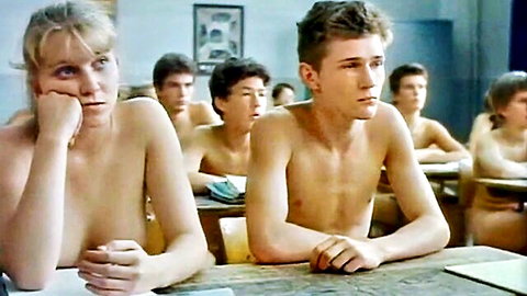 Vintage blonde with big tits topless in classroom surrounded by shirtless young men erotic scene
