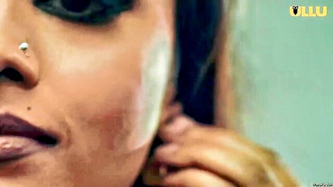 Seductive Indian aunty close-up with intense gaze and red lips