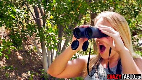 Excited blonde MILF September Reign spying with binoculars outdoors