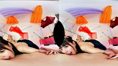 Seductive Asian teen in black lingerie lying provocatively