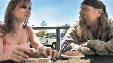 Katja Kassin and bearded lover sharing meal in teasing outdoor preview