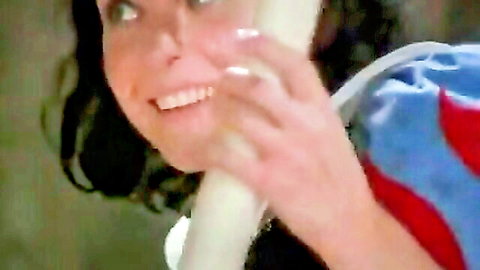 Vintage Snow White in sexy costume smiling with white object tease