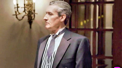 Mature suited man in elegant pose, from crime-themed big melons babes video