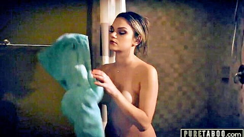 Nude blonde babe teasing bare tits with towel in steamy shower