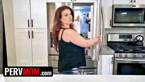 Curvy redhead MILF stepmom in tight tank top opening fridge showing big tits cleavage in kitchen