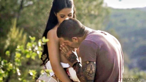 Carmella Jones Hispanic MILF topless outdoor embrace with lover