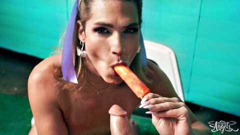 Trans woman with Jayden Marcos sucking orange popsicle and dildo in kinky indoor scene