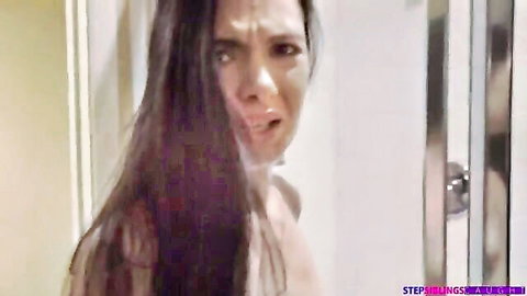Skinny brunette teen with small perky tits gasps in ecstasy topless in steamy bathroom