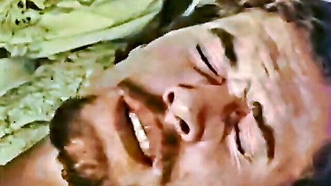 Vintage man with mustache in ecstatic close-up, eyes closed in pleasure