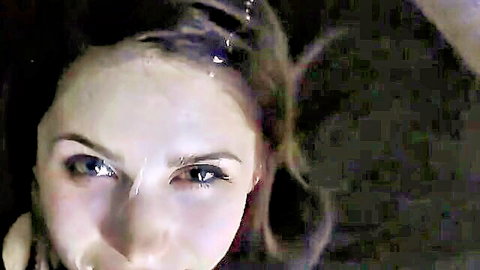 Close-up of amateur girlfriend's seductive face, brunette with blue eyes, from cumshot compilation