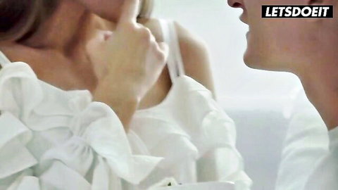 Sybil whispers intimately to boyfriend in white ruffled blouse, Sasha Rose nearby