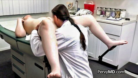 Brunette doctor in white coat gives blowjob to naked thick trans patient's erect cock in hospital stirrups