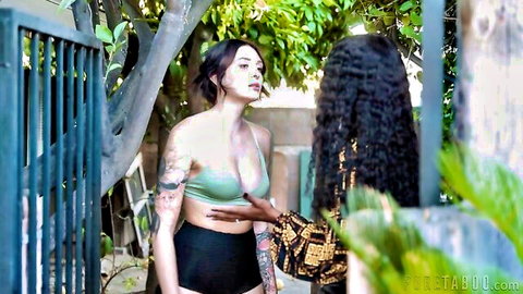 Charlotte Sins tattooed in green crop top, touched intimately by curly-haired woman