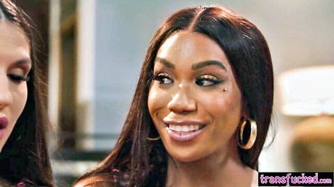 Jewelz Blu smiling with friend in steamy trans shemale video thumbnail