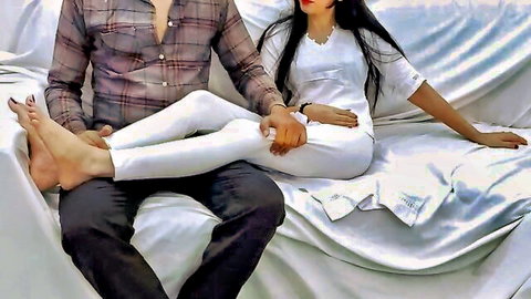 Curvy South Asian woman with long black hair spreads legs on man's lap in tight white leggings teasing intimately