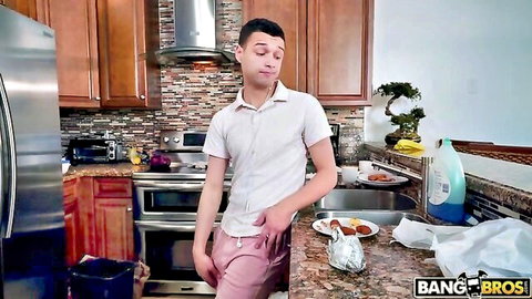 Young brunette guy smirking in tight pink pants bulge in kitchen Bang Bros teaser