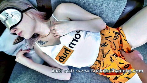 Blonde stepsister in tank top and orange shorts, hand teasing crotch while sleeping