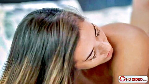 Eva Lovia sun-kissed nude beauty in intimate bedroom pose