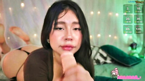 Asian cam girl teases lips in skimpy brown top and panties