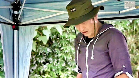 Japanese man in green hat and purple hoodie outdoors in wife swap JAV