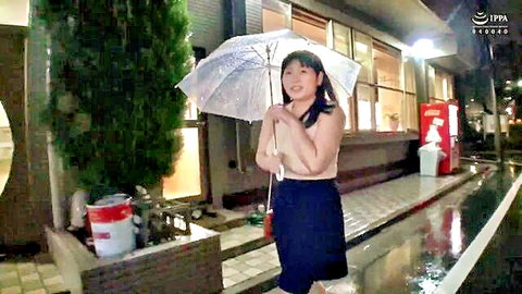 Busty chubby Asian woman in skirt holding umbrella in rainy night
