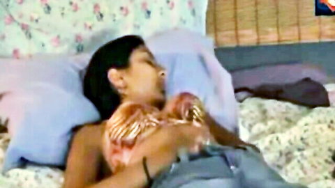 Namritha Indian girl relaxing on bed with cleavage in webcam tease