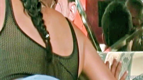 Ebony babe with braids in sexy mesh top, teasing pose