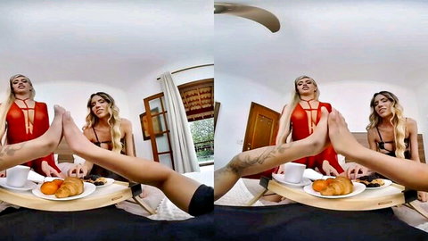 Two stunning Tgirls in red lingerie serve breakfast and tease with feet
