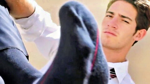 Handsome suited guy face pressed by dominant socked foot in gay foot worship BDSM