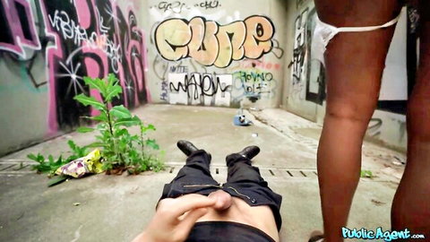 Ebony babe in white panties stands over guy's hard cock in public graffiti alley