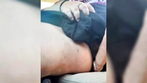 Lesbian squirting in car, woman exposed with hand on ass