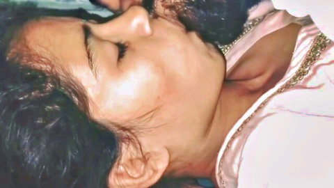 Indian Desi girlfriend passionately kissing in pink embroidered outfit