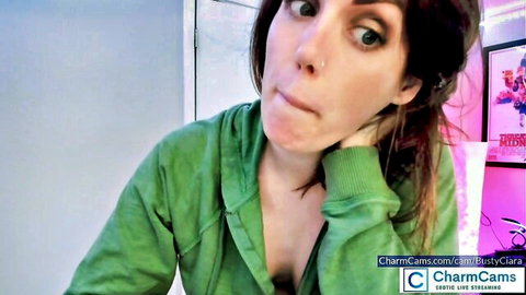 BustyCiara in open green hoodie teasing cleavage on live cam