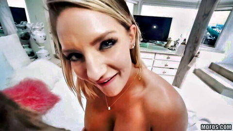 Topless blonde with perky tits smiles at POV camera pressing red ribbed dildo to her lips