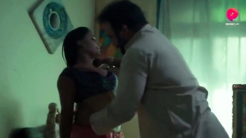 Indian seductress in blue top embraced intimately by man