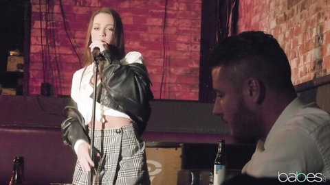 Danny Mountain watches sultry brunette singer in plaid skirt perform