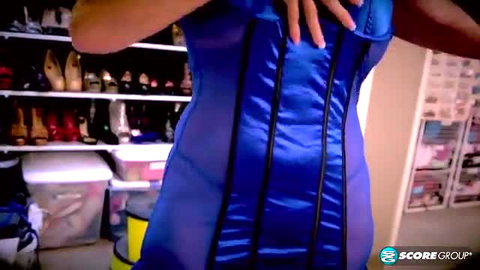 Curvy 50plus MILF in shiny blue satin corset showing big ass