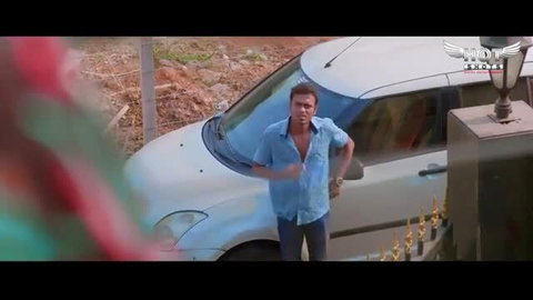 Handsome Indian man in blue shirt stands by white car in hot desi video