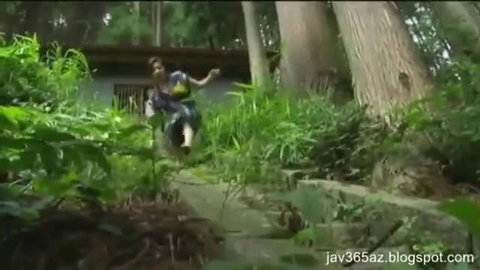 Japanese amateur village girl in dress dances outdoors in lush forest