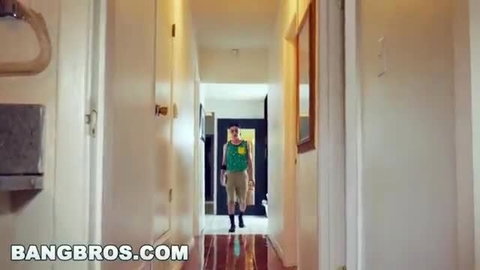 Lusty MILF in green tank top walks hallway, big tits butt tease